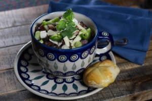 Healthy soup recipes: Caribbean Black Bean Soup - Polish pottery cup with soup and a roll