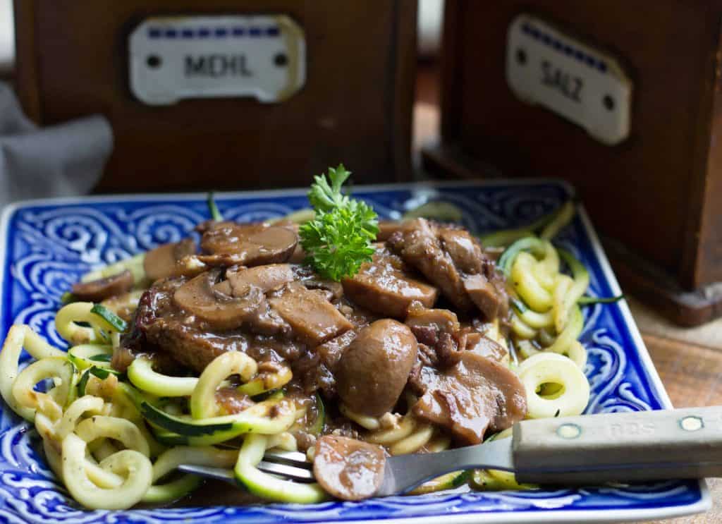 Instant Pot Pork with Creamy Mushrooms on a blue square plate