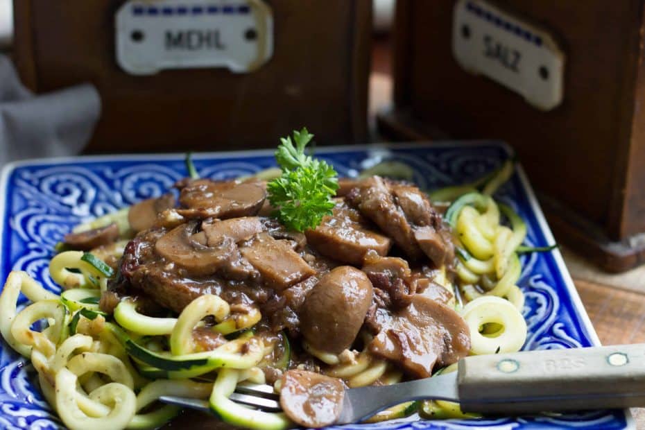 Instant Pot Pork with Creamy Mushrooms on a blue square plate
