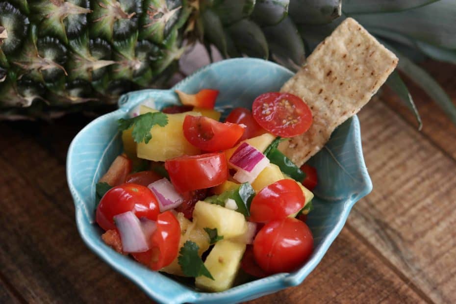 Pineapple Salsa with chip in bowl