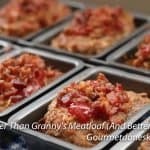 Meatloaf with ketchup and bacon crumbles in mini loaf pans