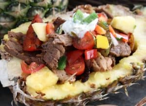 Pineapple Fajitas served in a pineapple shell