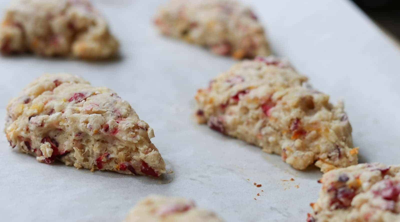 Hot fresh scones on a baking sheet.