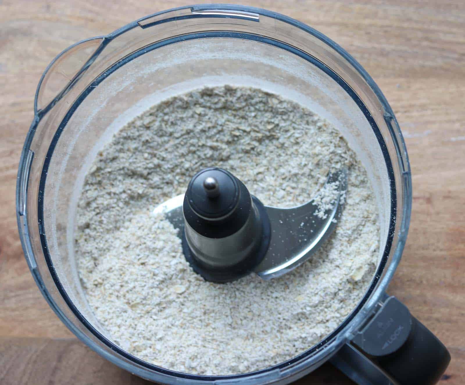 A food processor bowl with ground oatmeal from Gourmet Done Skinny