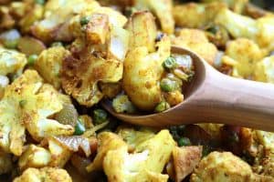 Roasted Indian Cauliflower Medley with wooden spoon from Gourmet Done Skinny