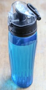 Blue water bottle with measuring guide on lid