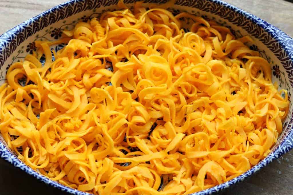 Spiralized butternut squash in a Polish potter casserole dish from Gourmet Done Skinny