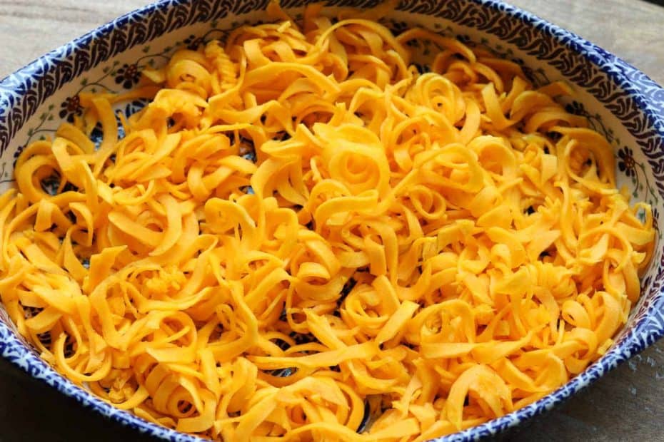 Spiralized butternut squash in a Polish potter casserole dish from Gourmet Done Skinny