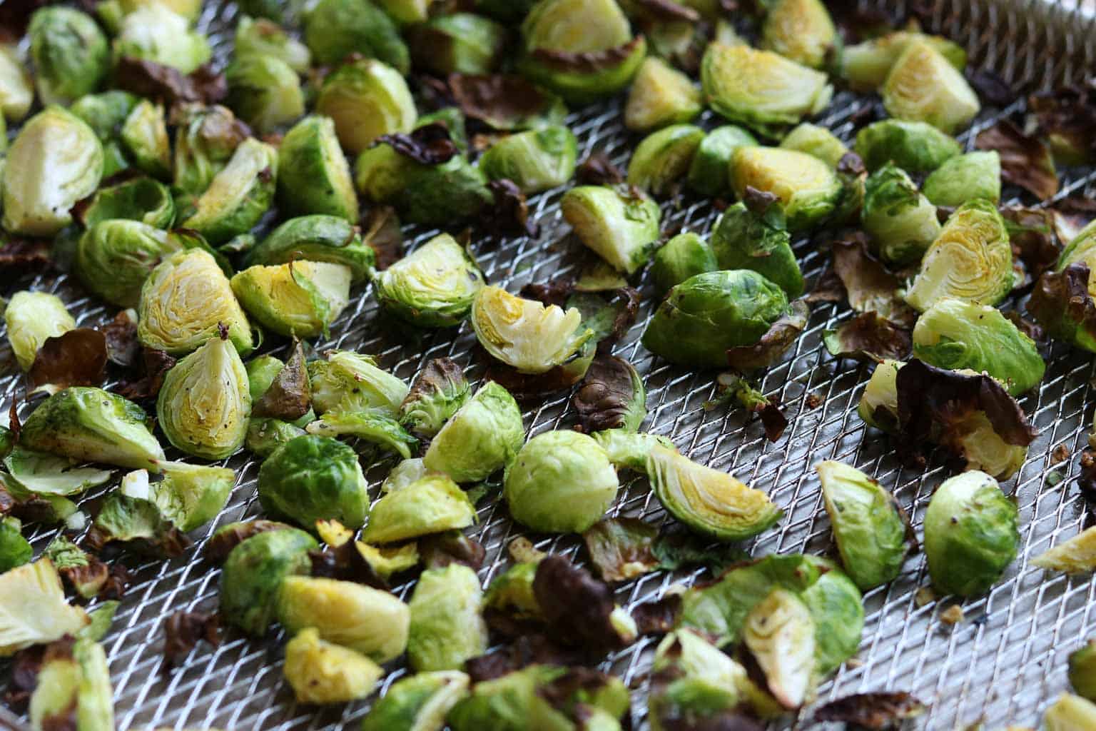 Crispy Air Fried Sesame Brussels Sprouts on an air fryer rack from Gourmet Done Skinny