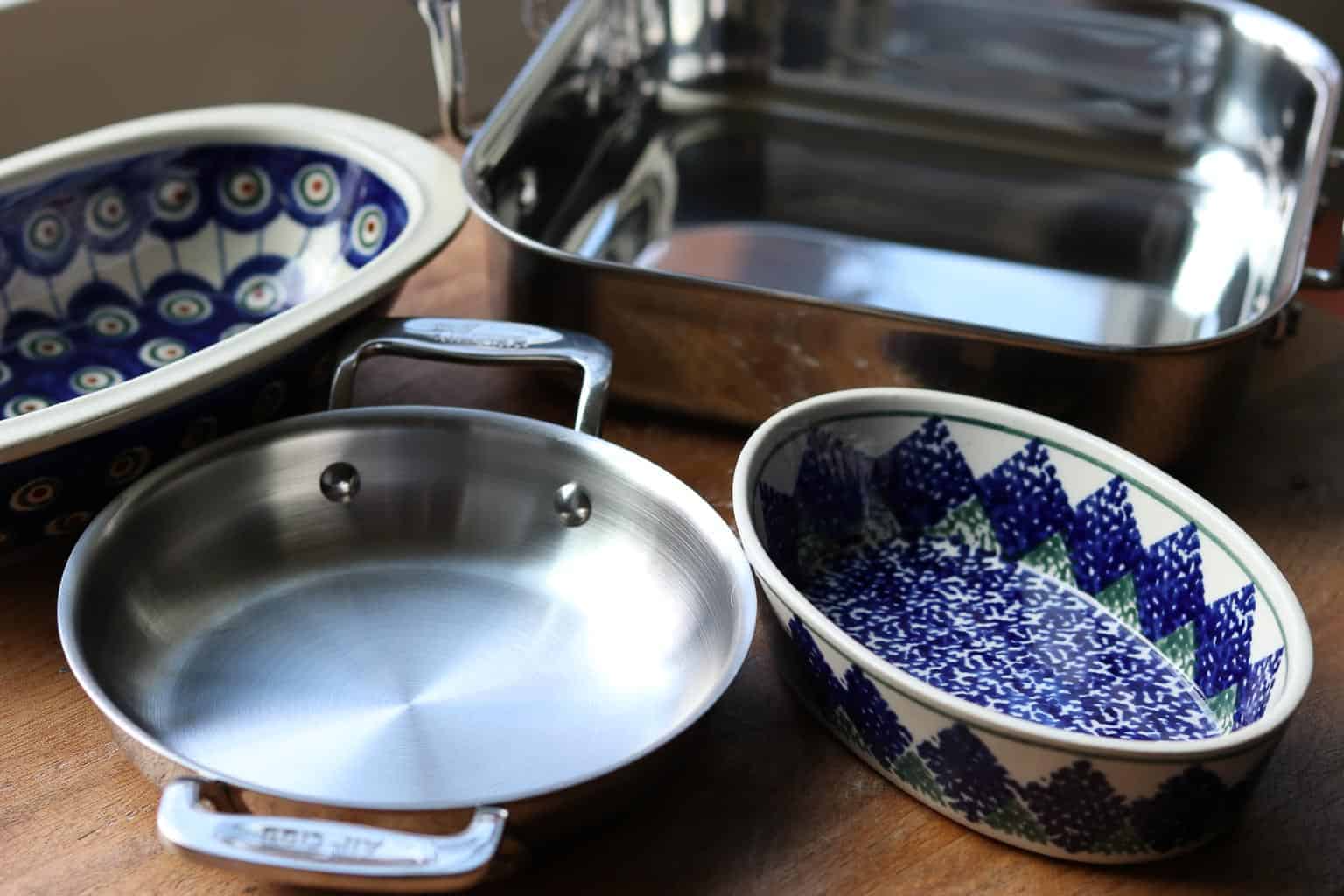 A variety of pans, Polish pottery dishes on a wooden board to use to bake the dip from Gourmet Done Skinny