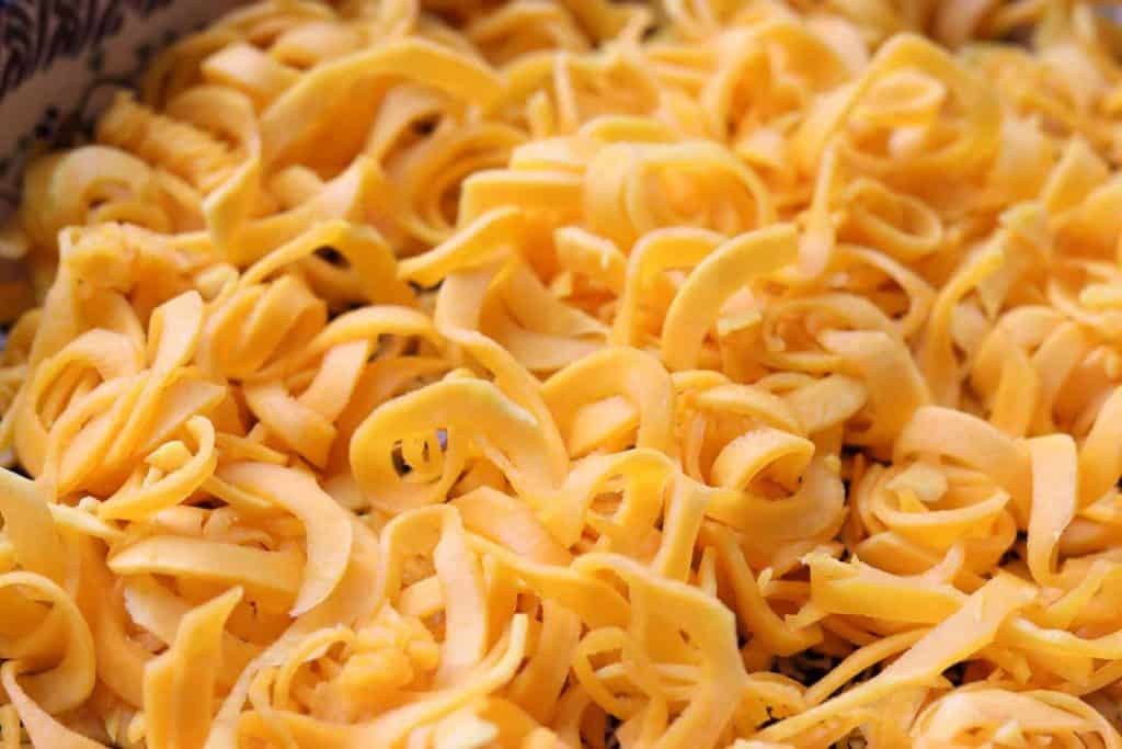 Spiralized butternut squash in a Polish potter casserole dish from Gourmet Done Skinny