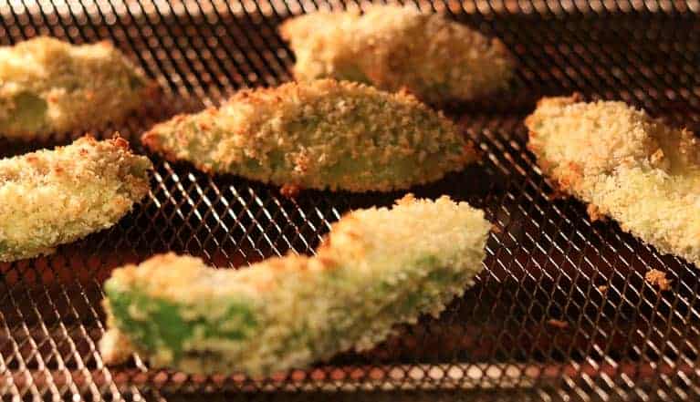 Battered avocados on a wire rack in the Breville Smart Oven Air from Gourmet Done Skinny
