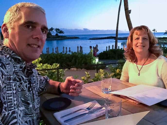Man and woman on date night at a table in Hawaii from Gourmet Done Skinny