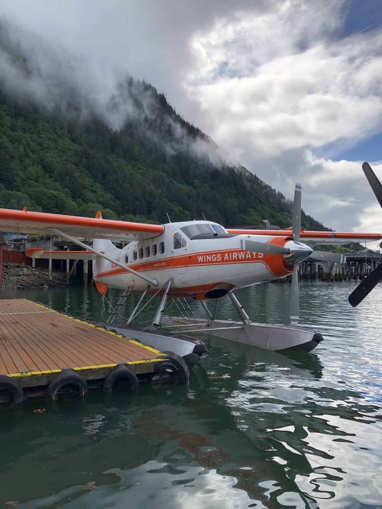 Seaplane with mountain and clouds in background