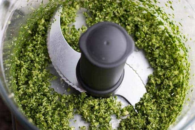 Pesto ingredients combined in the food processor