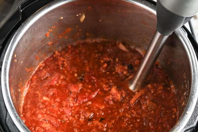 Tomato Bacon Jam with an immersion blender in the Instant Pot from Gourmet Done Skinny