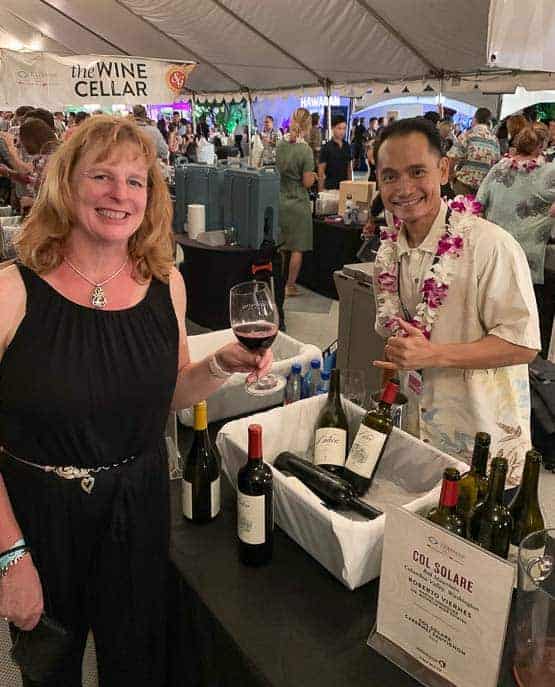 Amy at the Hawaii Food and Wine Festival holding a glass of wine