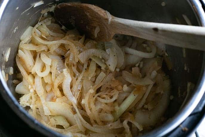 Onions browning in Instant Pot from Gourmet Done Skinny