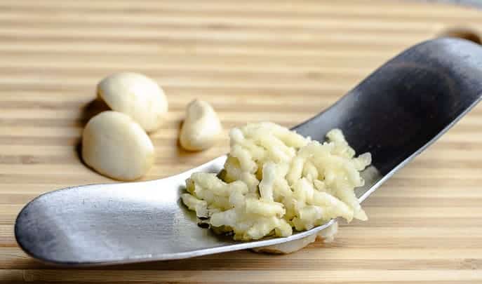 Garlic rocker with minced garlic and cloves from Gourmet Done Skinny