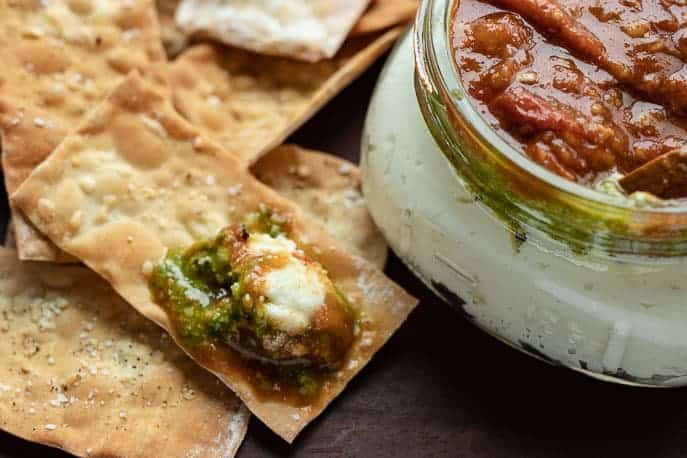 Crackers with tomato bacon jam and ricotta and a ricotta jam jar