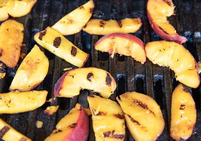 Peach slices on the grill with grill marks