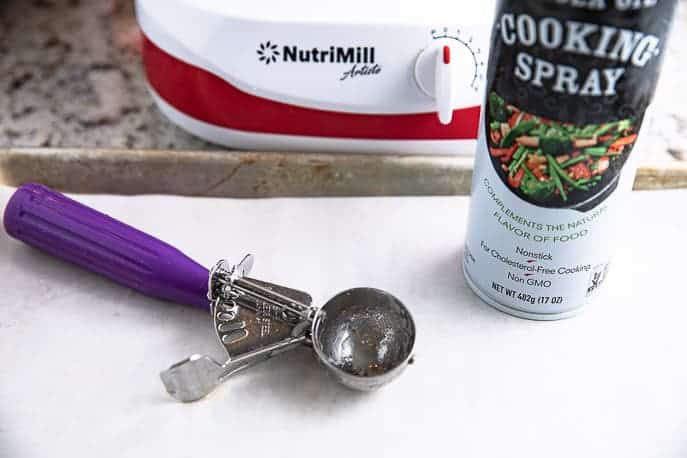 cookie scoop sprayed with cooking spray and Nutrimill Artiste mixer