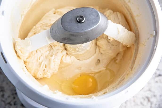 Nutrimill Mixer with cream cheese mixture and egg