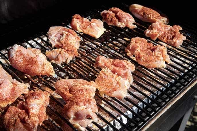 raw chicken with Chipotle seasoning on a grill