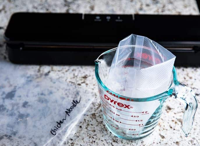 measuring cup with vacuum seal bag and sealer