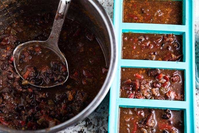 soup pot with spoon, souper cubes with soup, vacuum sealed bags