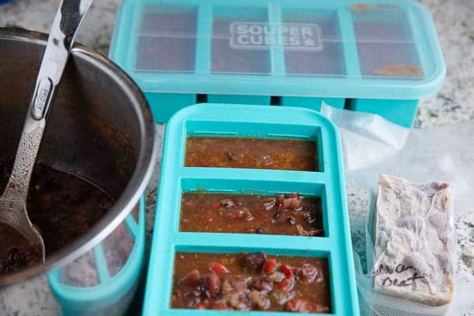 soup pot with spoon, souper cubes with soup, vacuum sealed bags