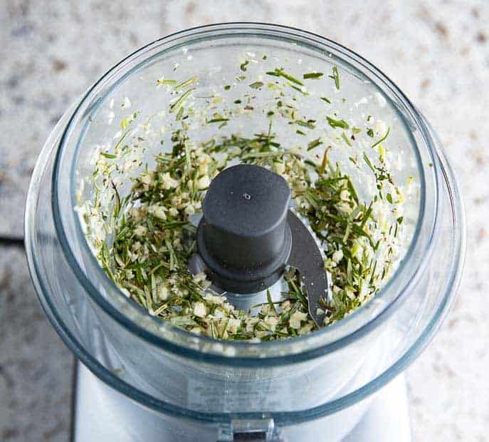 rosemary, thyme and garlic minced in top of a Magimix food processor