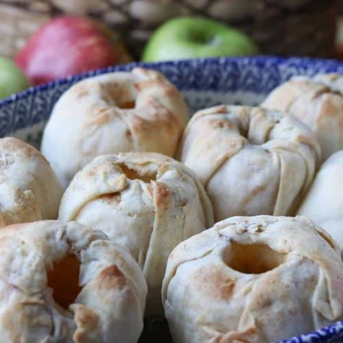healthy apple dumplings in a Polish pottery baking dish with apples around