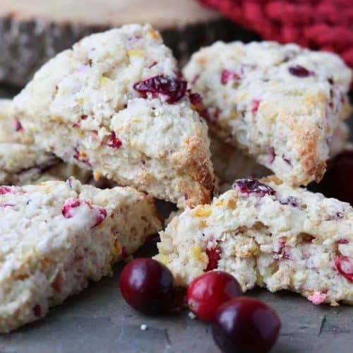 cranberry scones on a slate with cranberries