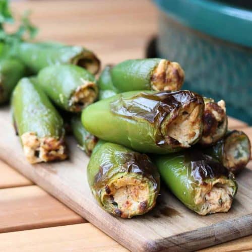 stuffed jalapenos on a board