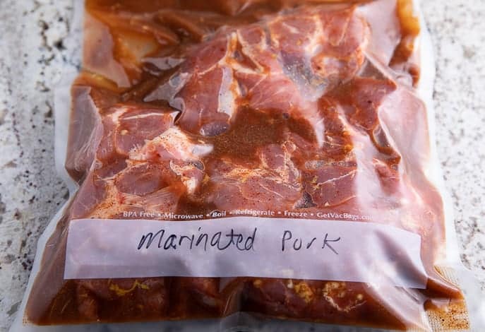 pork marinating in a vacuum sealed bag