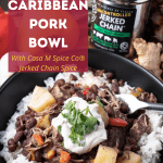black bowl with Caribbean pork, peppers, spice, pineapple around