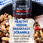 breakfast scramble in bowl with spice container