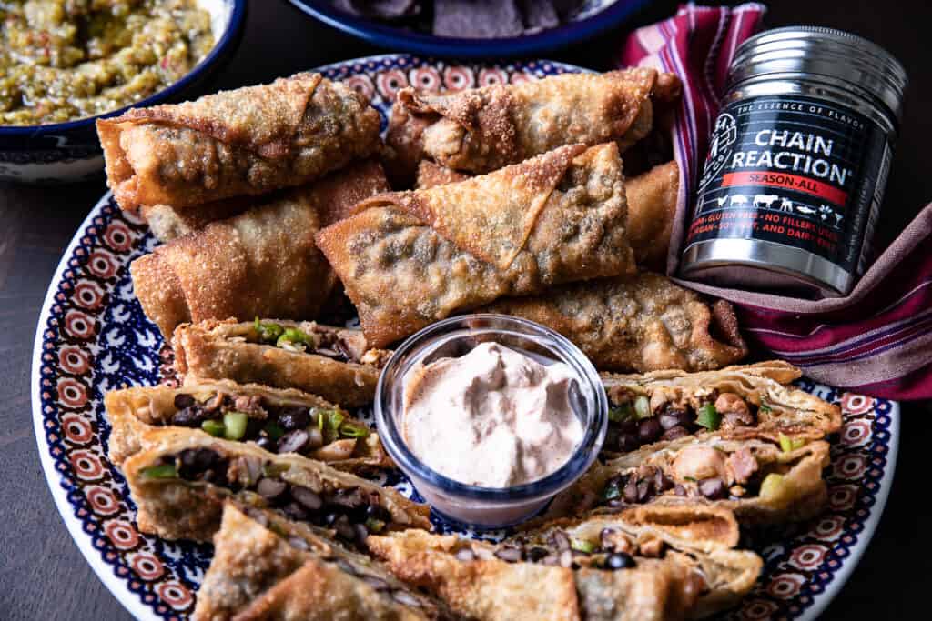 Southwest egg rolls on a platter with Chain Reaction spice
