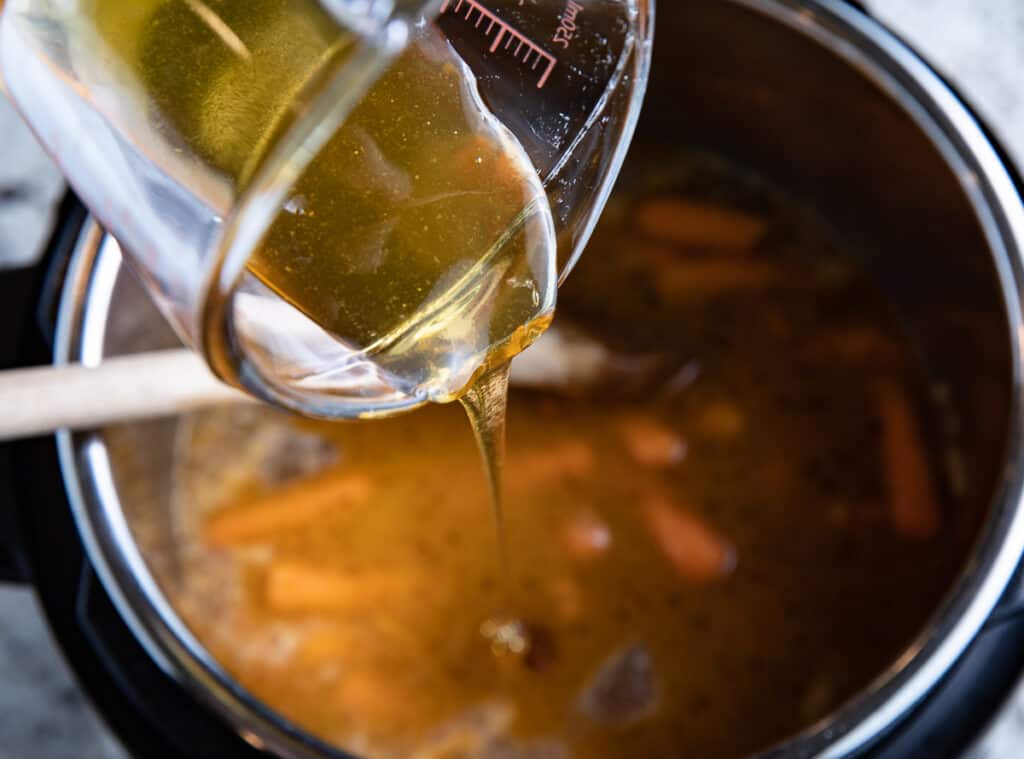 honey being poured into Instant Pot