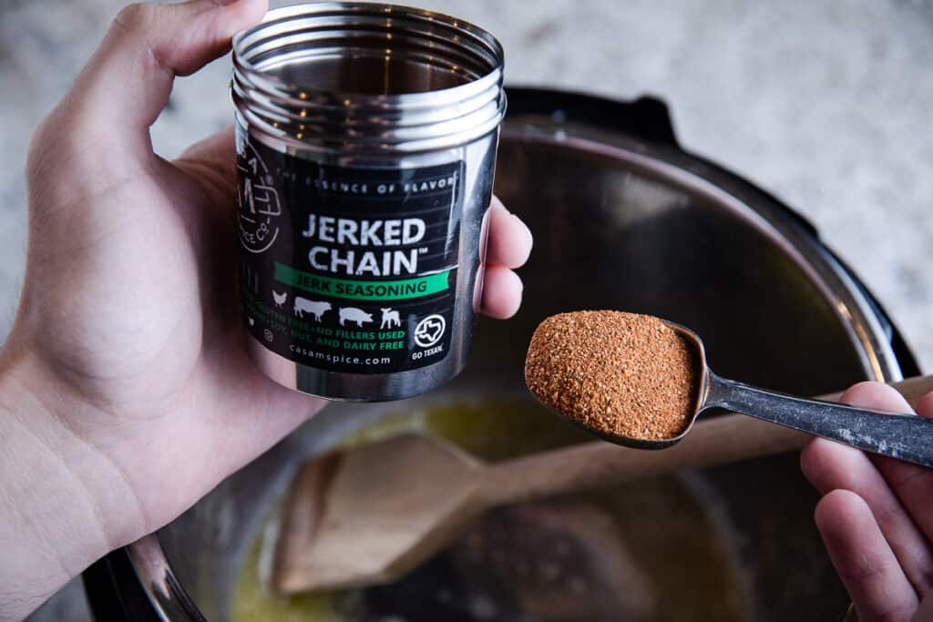 Casa M Jerked Chain spice and a tablespoon with spice over Instant Pot