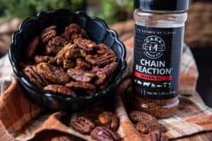 Spicy pecans in a bowl with Chain Reaction Spice