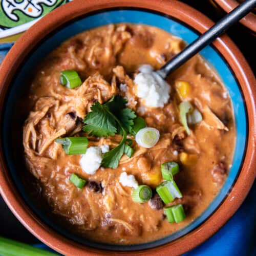 Enchilada Soup in a bowl with spoon