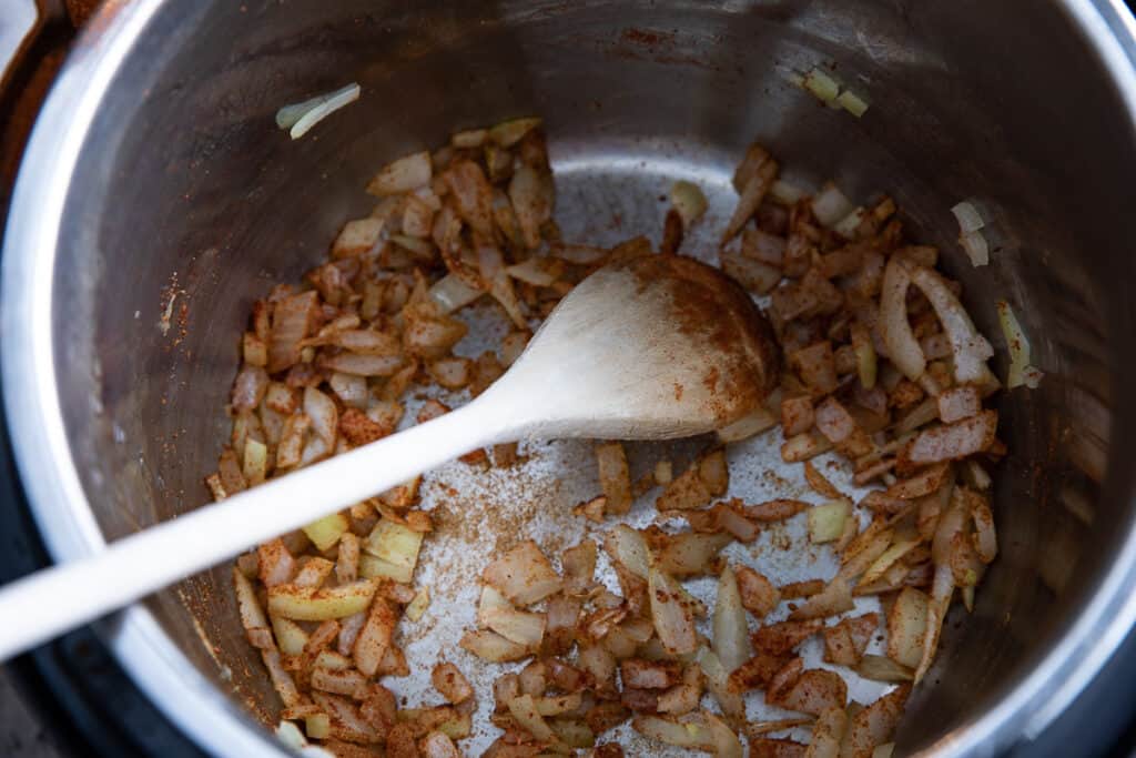 onions and spice in pot